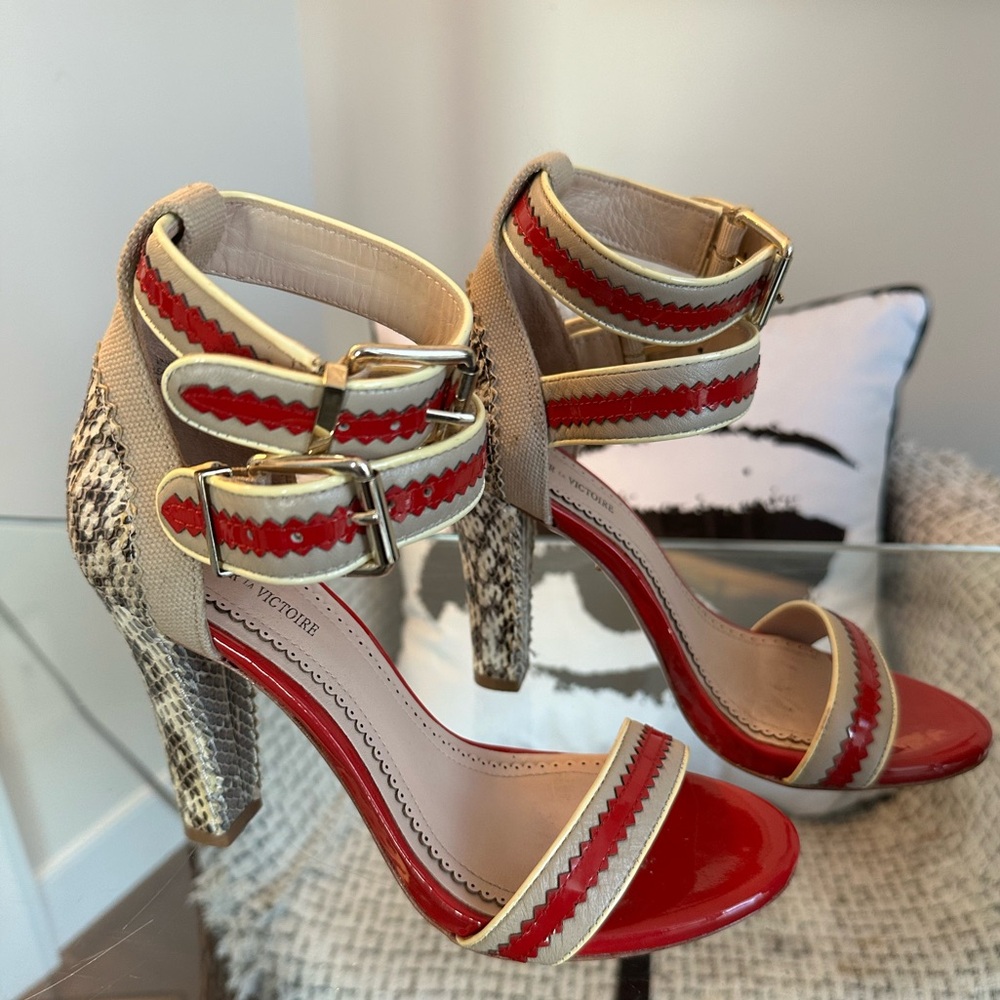 Strappy red, nude, and snakeskin shoes. 4 inch heel with 1/2 inch platform